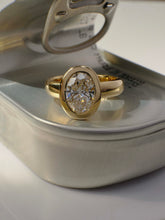 Load image into Gallery viewer, Gold ring with a diamond on a silver jewelry box