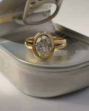 Load image into Gallery viewer, Gold ring with a diamond on a silver jewelry box