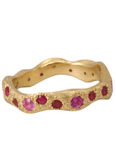 Load image into Gallery viewer, A gold band ring with round natural rubies and spinels set in a textured band design.