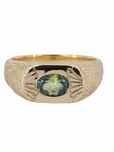 Load image into Gallery viewer, A gold band ring with a central natural Australian parti sapphire and hand-engraved ginkgo leaf design extending onto the band.
