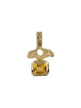 Load image into Gallery viewer, A gold-colored pendant featuring hand-carved oregano leaves above a bright emerald cut citrine.