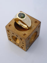 Load image into Gallery viewer, Gold ring with a gemstone on a wooden block with holes
