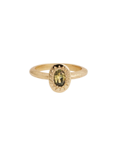 Load image into Gallery viewer, A gold band ring with a central stone, possibly a sapphire, set in a mounting with intricate details.
