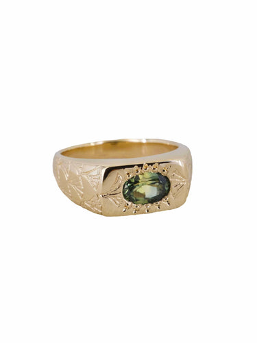A gold ring with a natural Australian parti sapphire, featuring a hand-engraved art deco fan pattern on the face.