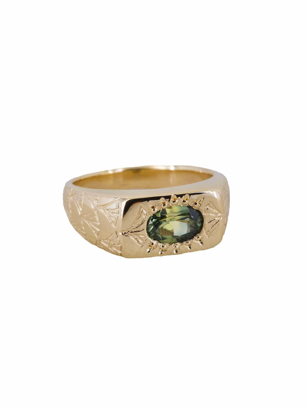 A gold ring with a natural Australian parti sapphire, featuring a hand-engraved art deco fan pattern on the face.