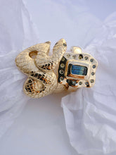 Load image into Gallery viewer, Gold ring with gemstone on white fabric background
